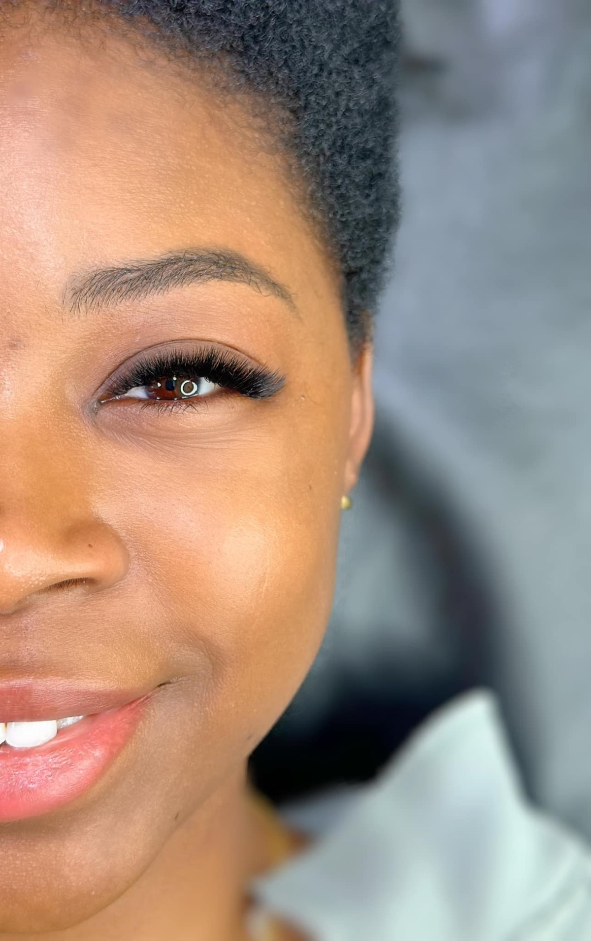 Smiling client wearing lash extensions