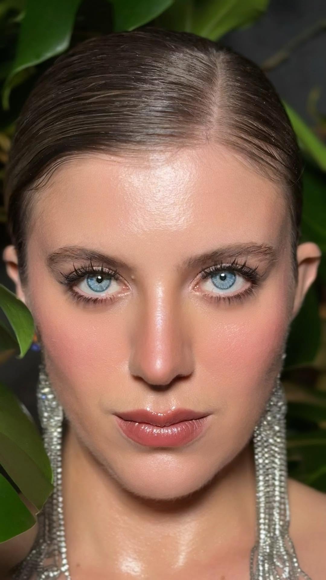 Makeup portrait with statement earrings