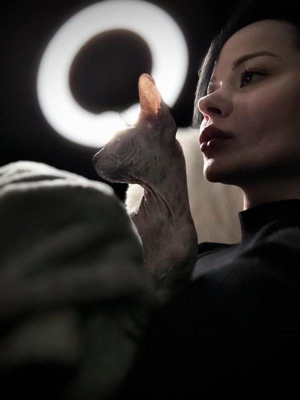 Olivia at home with her Sphynx cat